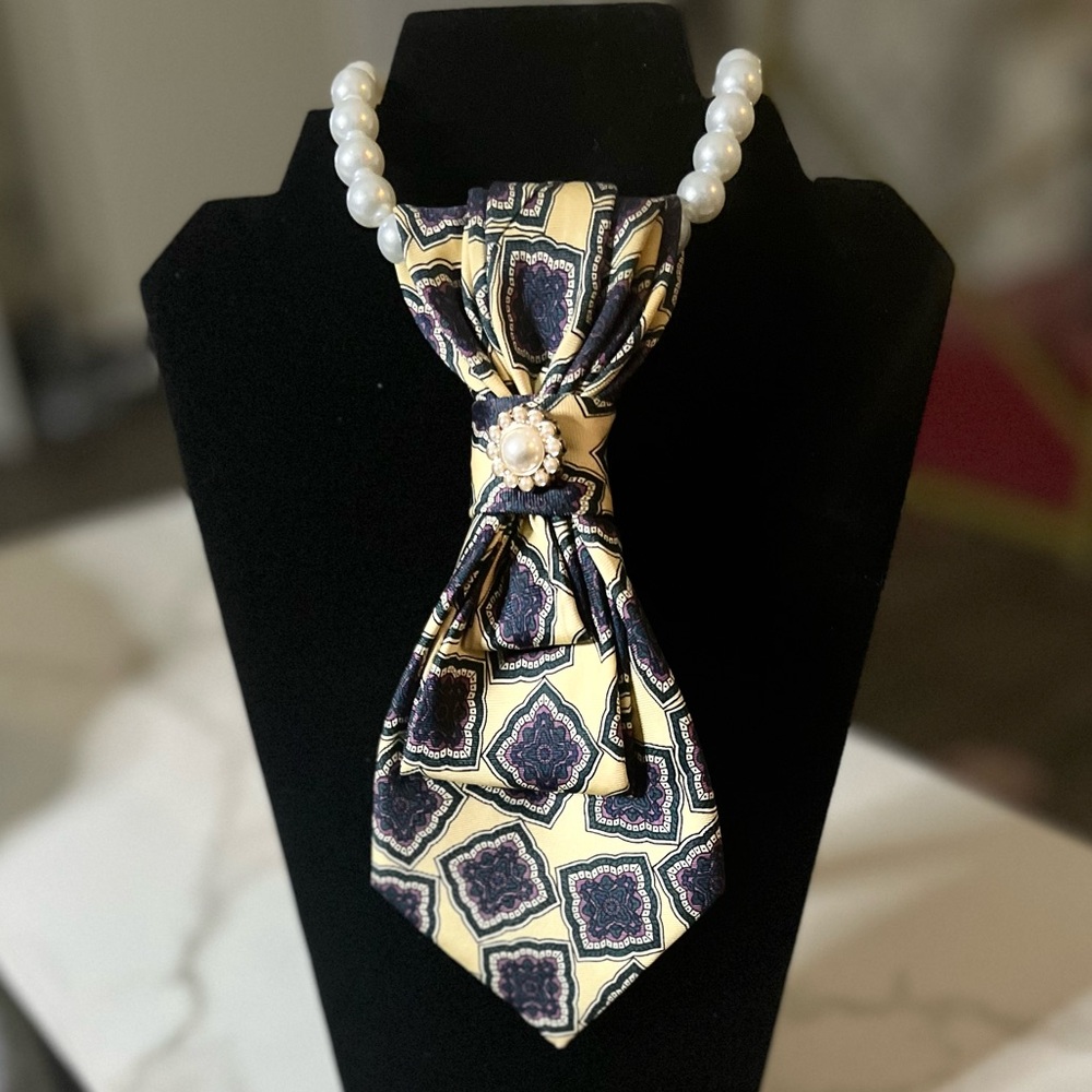 Elegant Yellow and Blue Patterned Necktie necklace with a pearl brooch..